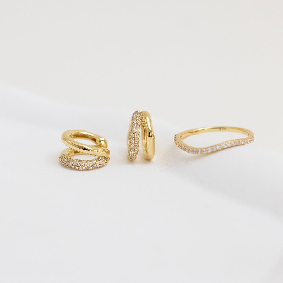 A slim, elegant ring with multiple small cubic zirconias set in a coloured band.