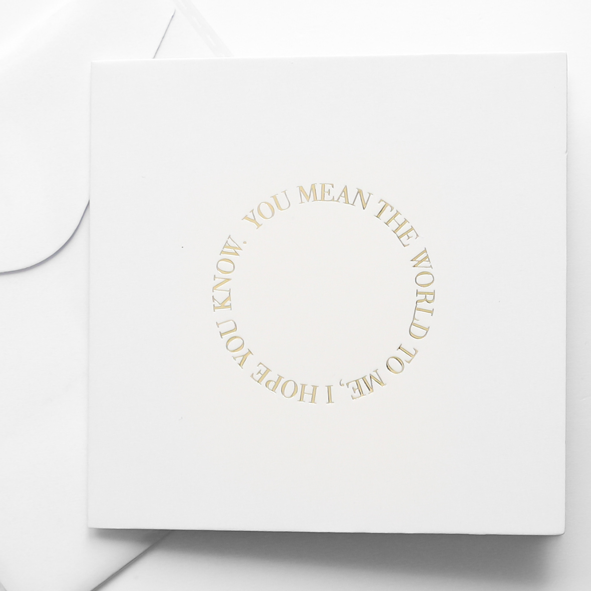 A greeting cards displayed on a neutral background, featuring designs such as 'you mean the world to me'.