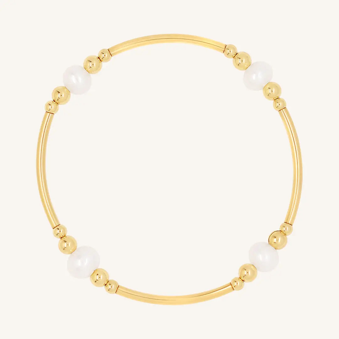 A gold-colored bracelet with natural freshwater pearls, designed with a beaded pattern.