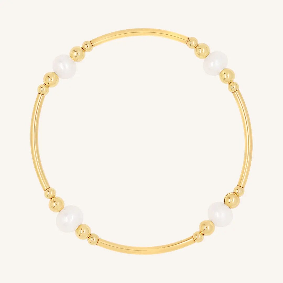 A gold-colored bracelet with natural freshwater pearls, designed with a beaded pattern.