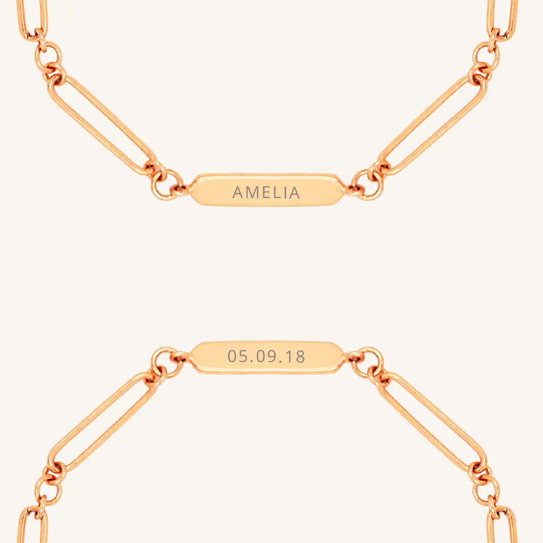 A rose chain bracelet with an engraveable panel.