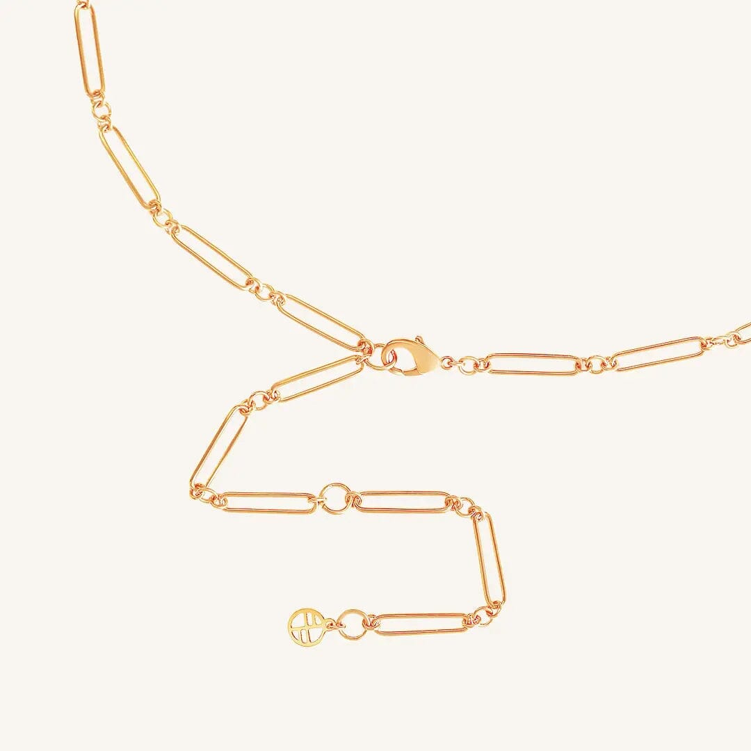 A rose chain necklace with two engraveable panels close up on clasp on a white background