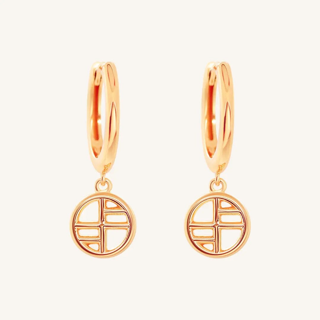 A pair of rose-tone drop earrings with the francesca logo