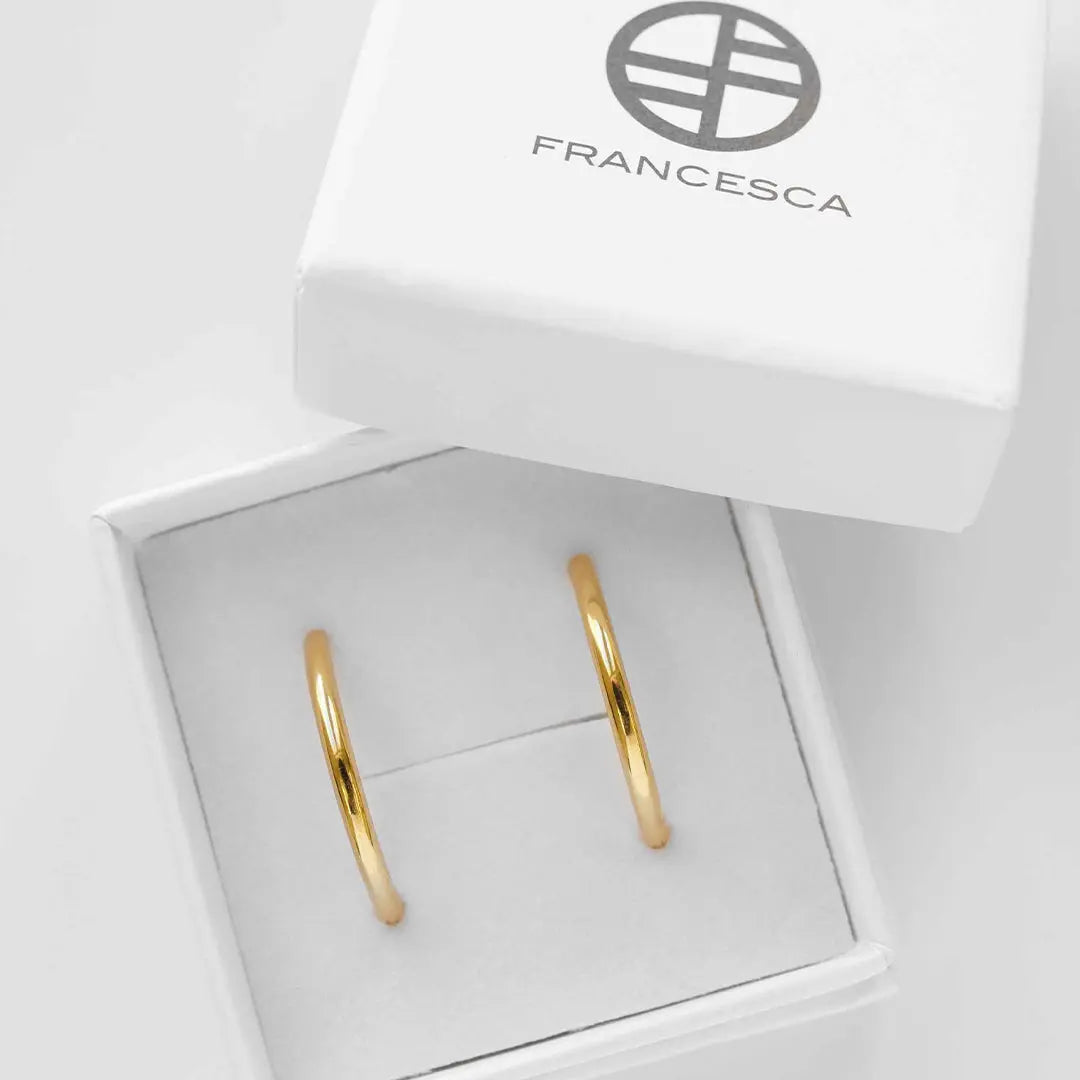 Gold hoops, displayed in white box