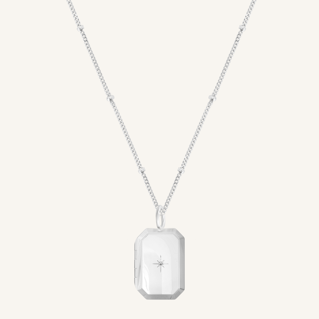 Silver Bevel Locket on bobble chain on white background