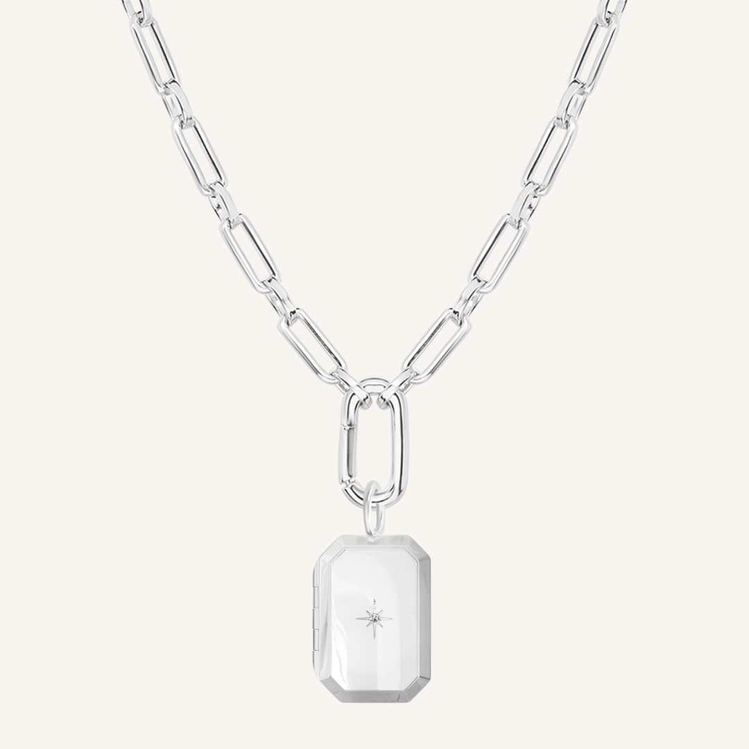 Silver Bevel Locket on link chain on white background