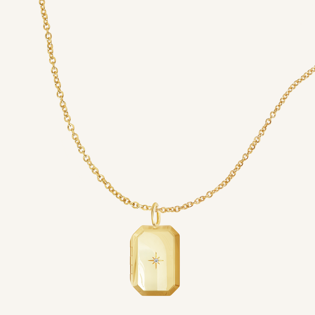 Gold Bevel Locket on plain chain on white background