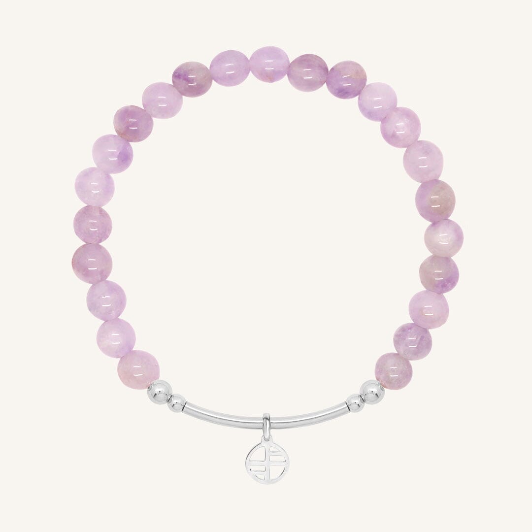 Purple beaded bracelet with a silver clasp on a white background