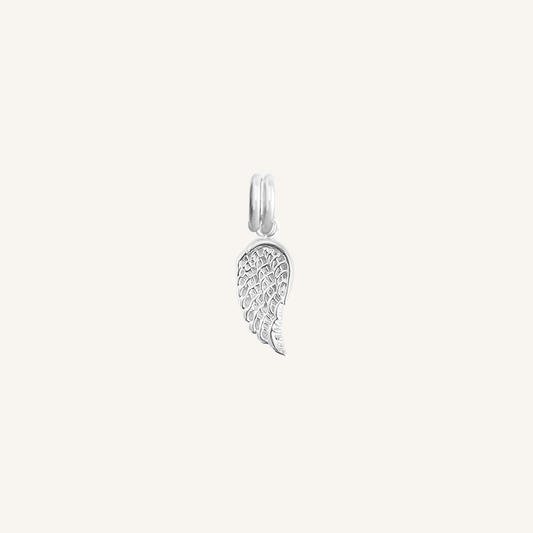 A silver-coloured angel wing charm with intricate details