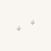 A silver pair of stud earrings featuring a white cubic zirconia, representing April.