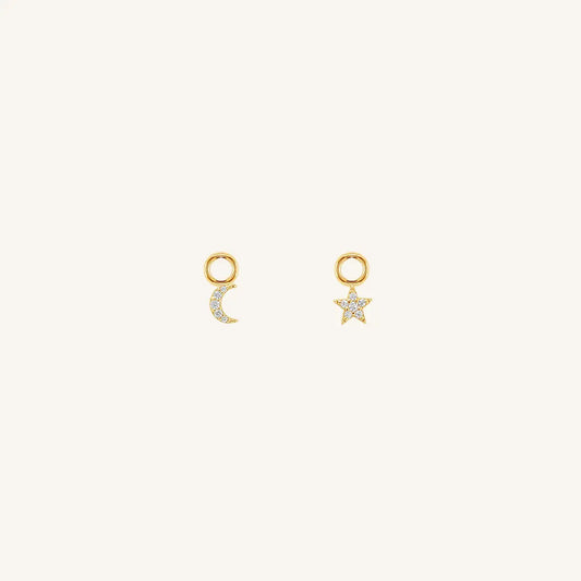 The  GOLD  Astro Hoop Charm Set of 2 by  Francesca Jewellery from the Earrings Collection.