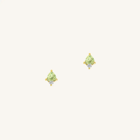 A gold pair of stud earrings featuring a green cubic zirconia, representing August.
