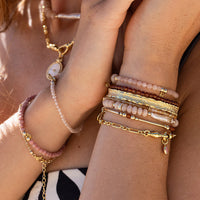 Gold chain bracelet on a white background