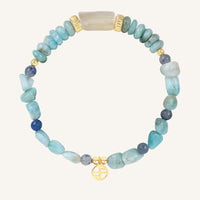 Beaded bracelet with blue and gold accents on a white background