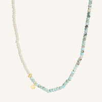 Necklace with small beads on a white background