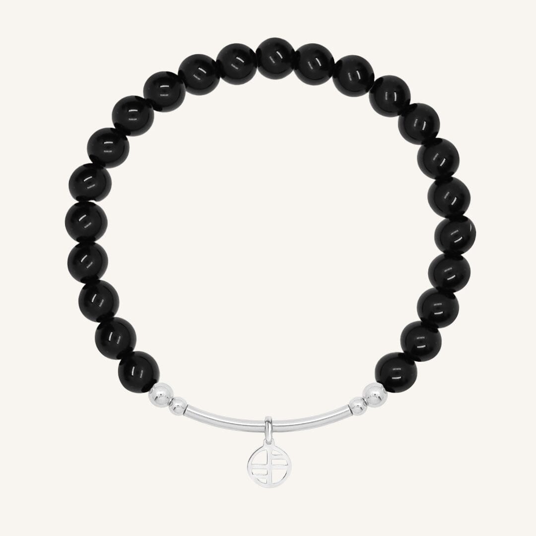 Black beaded bracelet with a silver bar on a white background