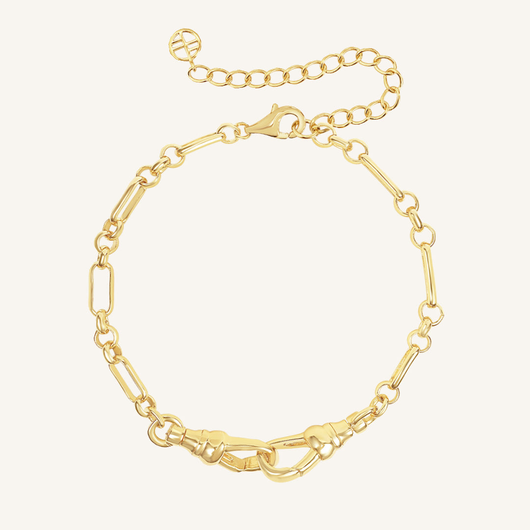 Gold chain bracelet on a white background