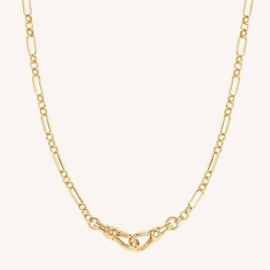 Gold chain necklace on a white background
