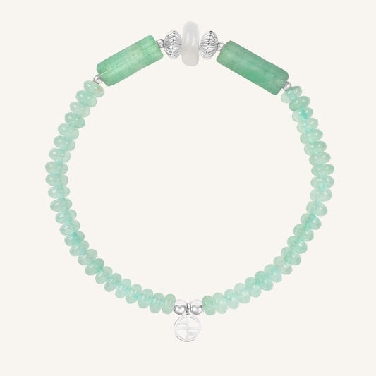 Bracelet with green beads on a white background
