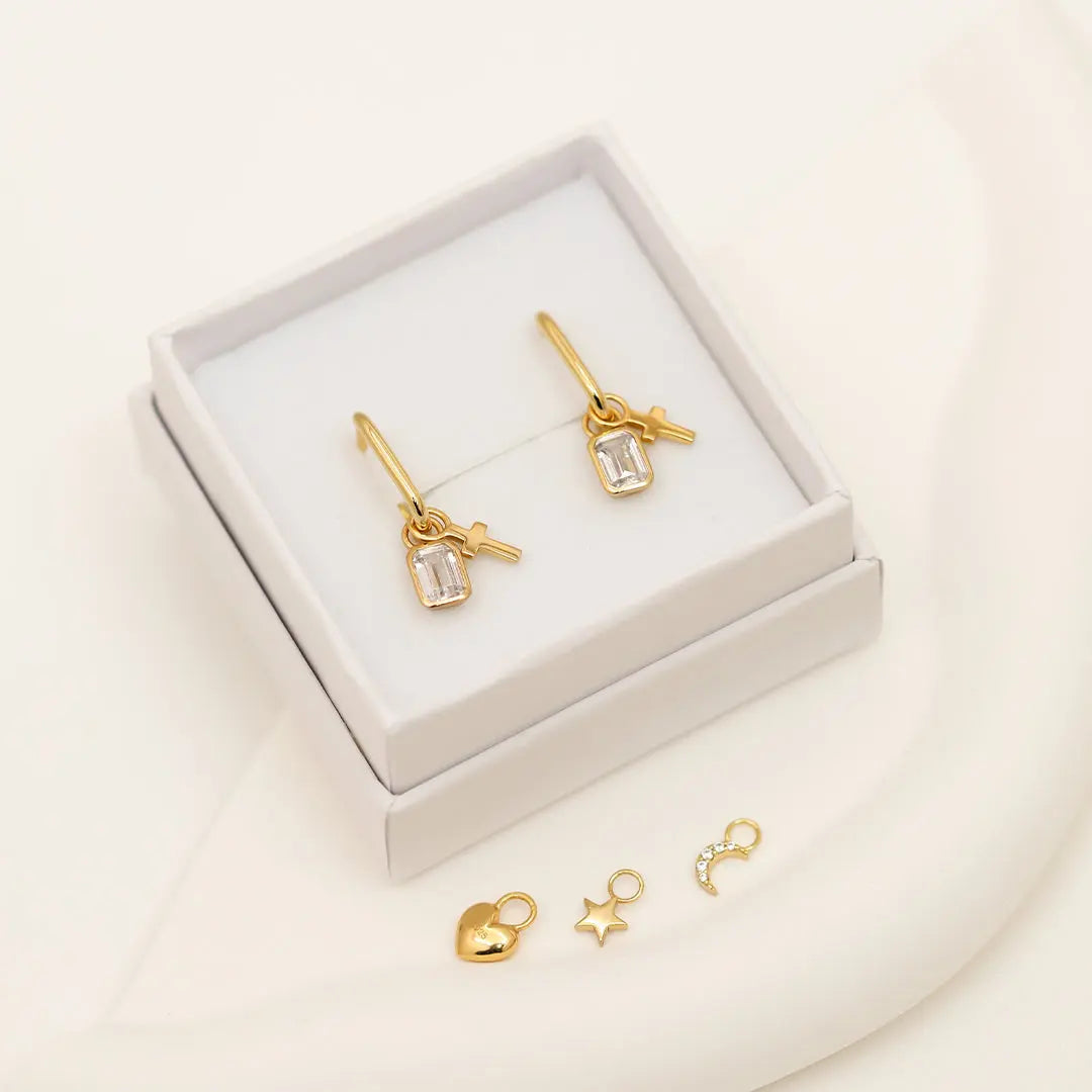 The    Cross Hoop Charm Set of 2 by  Francesca Jewellery from the Earrings Collection.