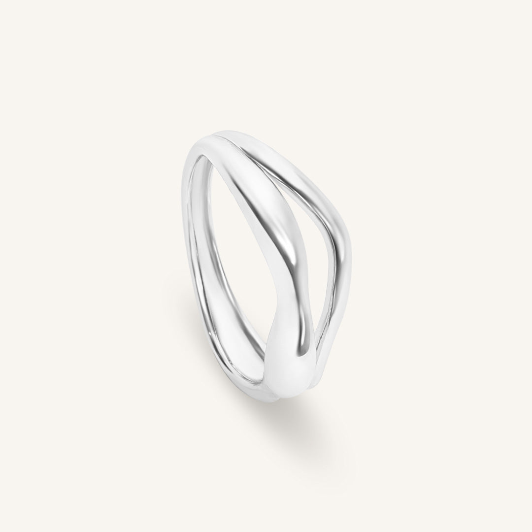 Silver ring on a light gray background
