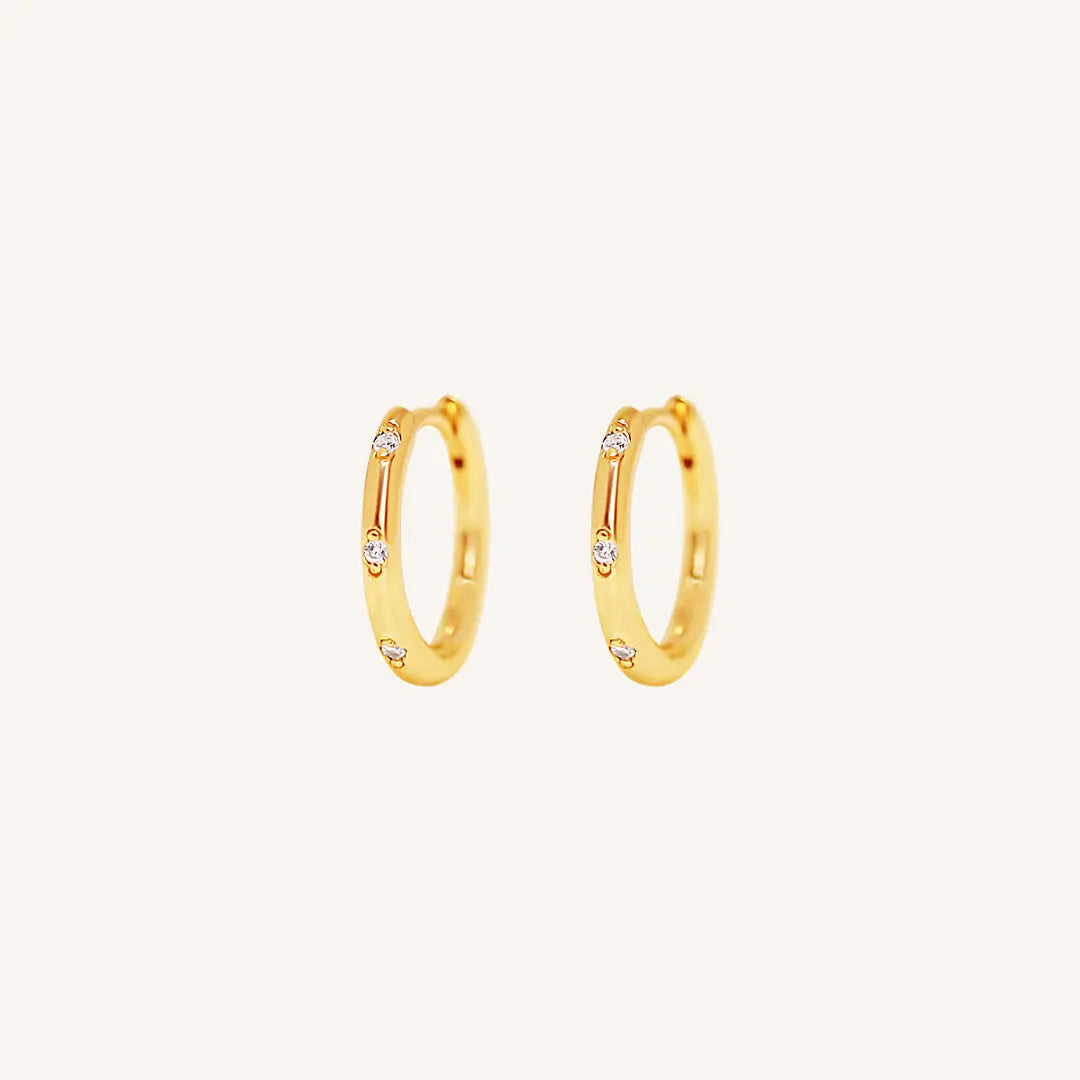 The  GOLD  Cruise Huggies by  Francesca Jewellery from the Earrings Collection.