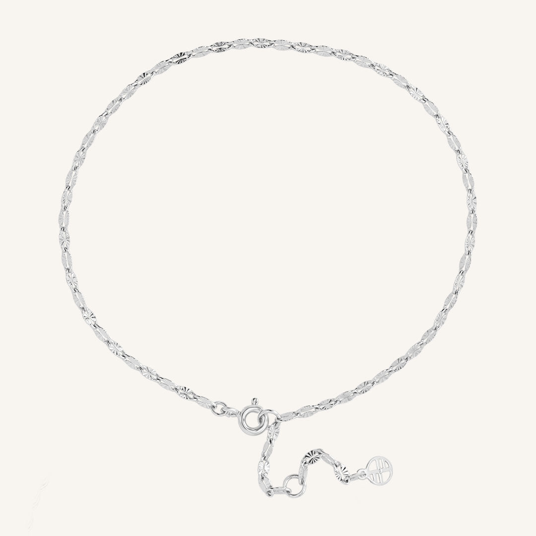Silver anklet on a white background