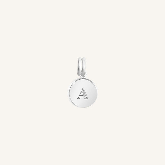 A silver round charm with the letter 'A'  on it, presented against a white background.