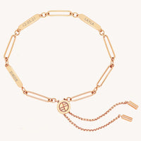 A rose Etch chain bracelet with three panels for engraving, featuring an adjustable fastening mechanism.