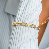 A chunky link style bracelet in silver tone, featuring a clasp closure.