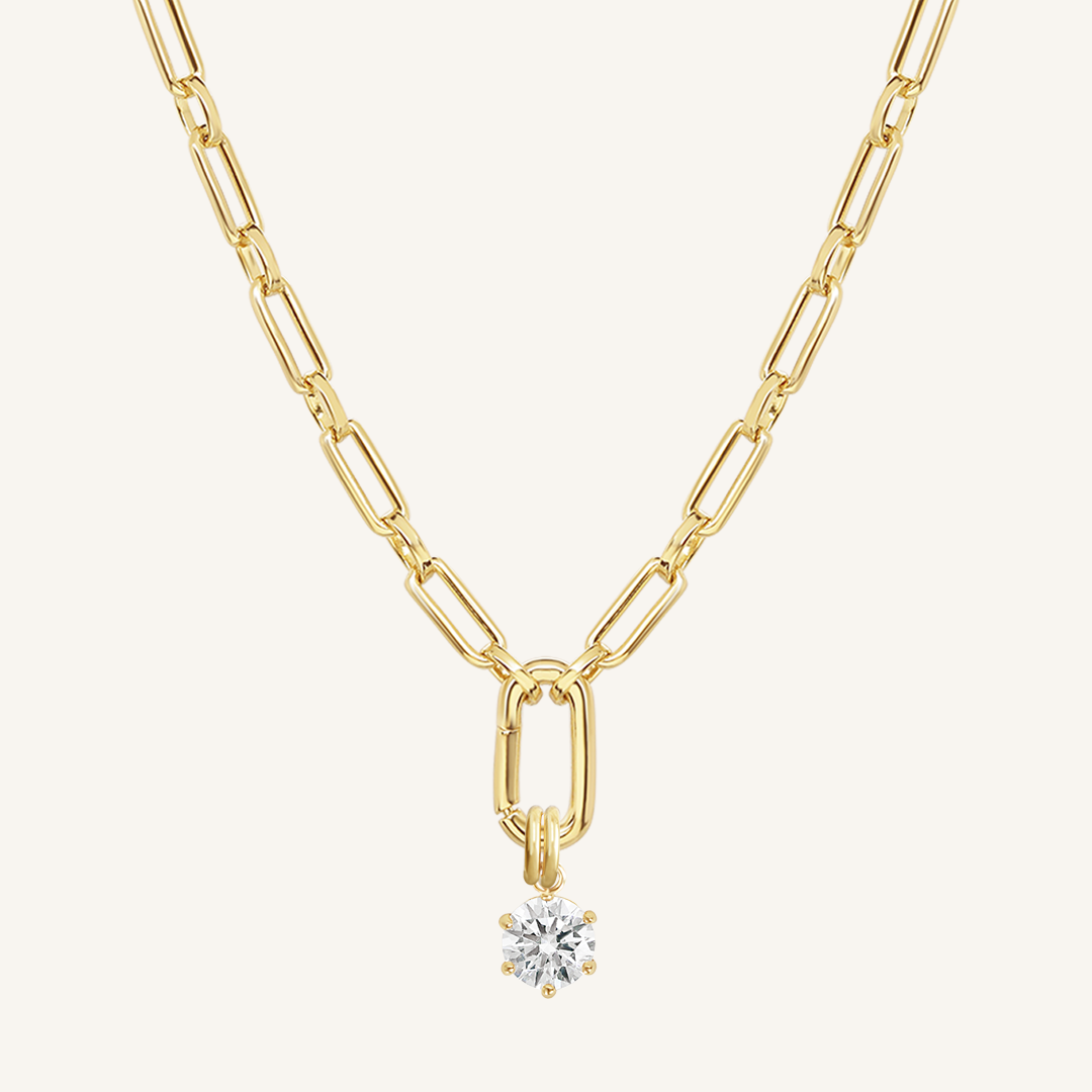 Round, gold, cubic zirconia charm on gold chain