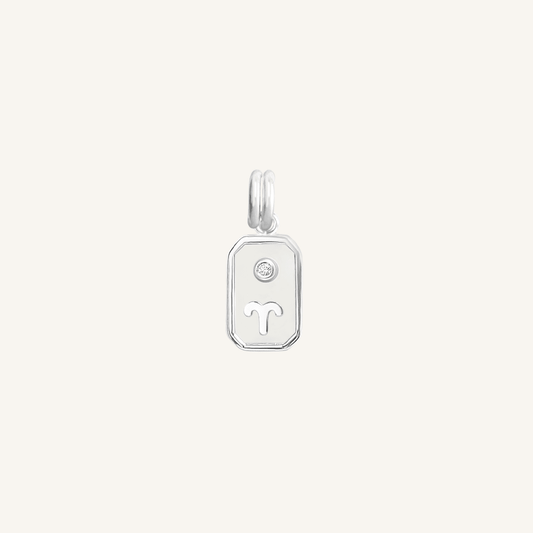 A silver rectangular shaped charm with the Aries zodiac symbol on it, designed with an iridescent finish.