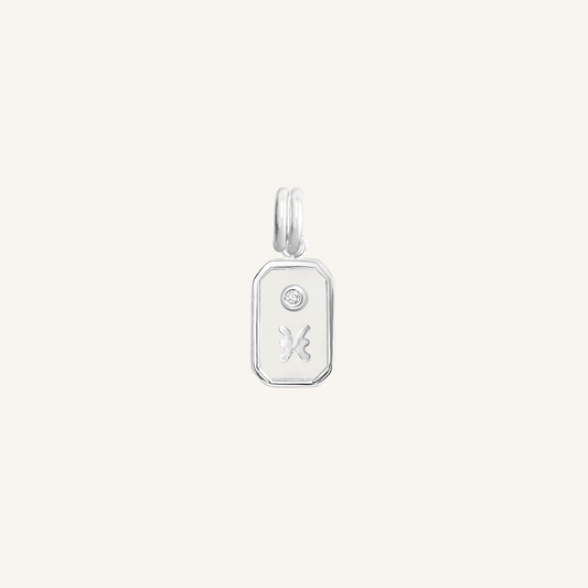 A silver rectangular shaped charm with the Pisces zodiac symbol on it, designed with an iridescent finish.