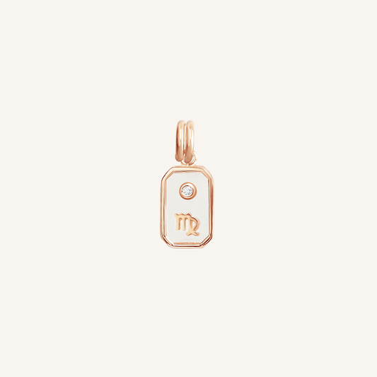 A rose gold iridescent zodiac charm representing the Virgo sign, with a loop for attachment, displayed against a white background.