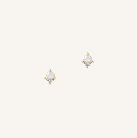 Pair of gold and pearl earrings on a white background