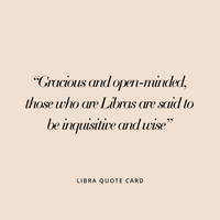 A rose gold charm in the shape of the Libra zodiac symbol.