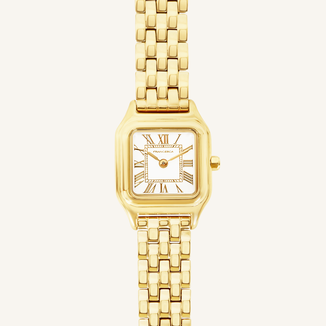 A luxurious coloured metal band watch with a square face and analog display.