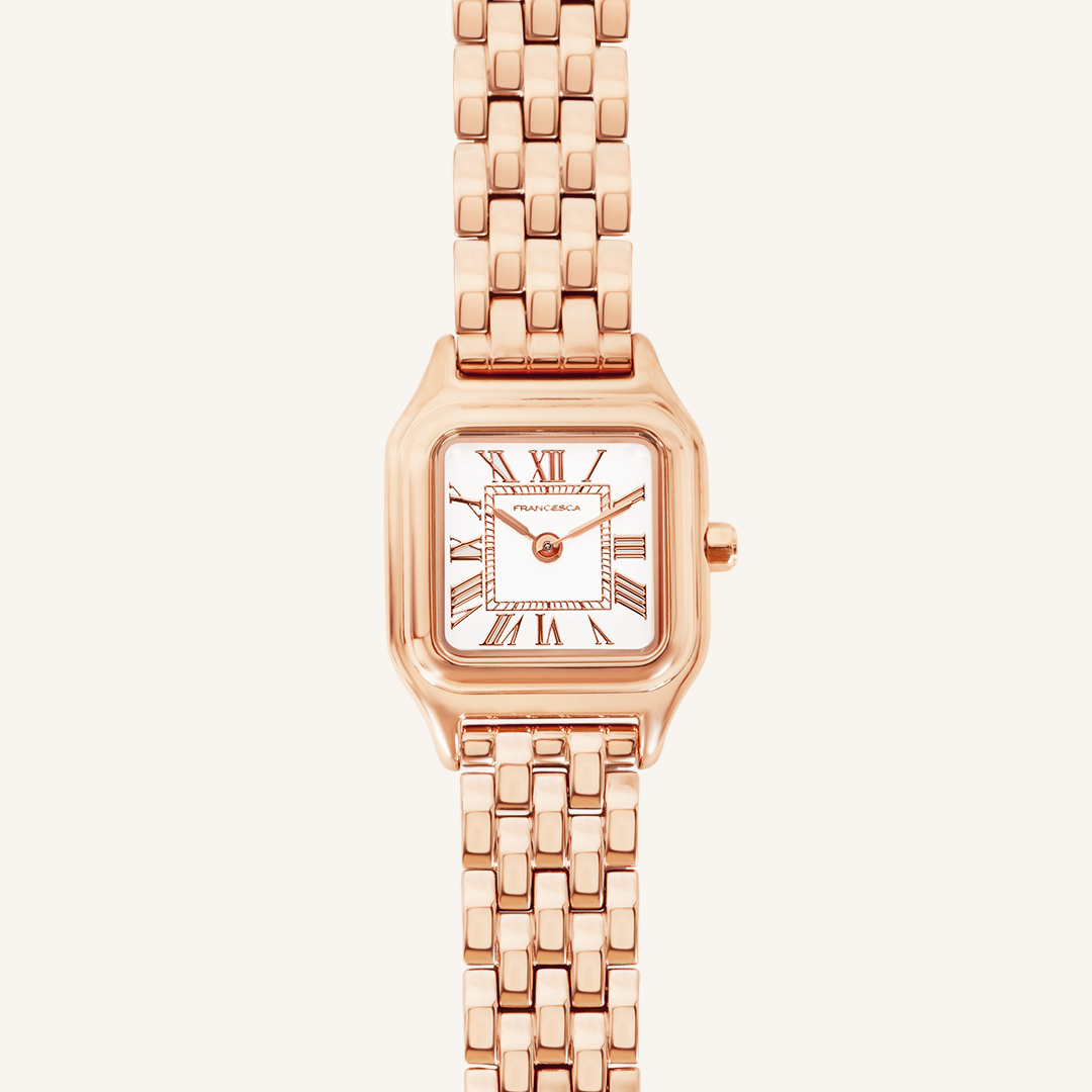 A rose gold-toned Louis Watch with a link bracelet and a square face featuring Roman numerals.