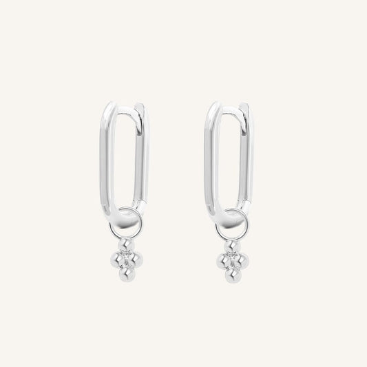 A pair of silver-colored rectangle hoop earrings with petite bobble details.