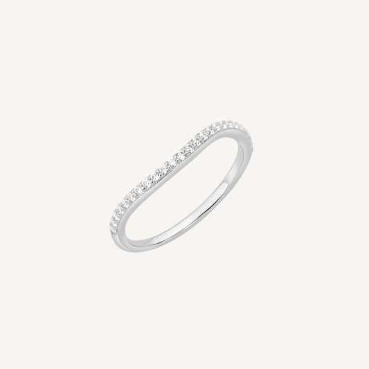 A slim, elegant ring with multiple small cubic zirconias set in a silver coloured band.
