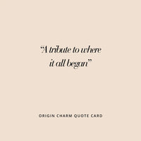 A silver-colored charm in the shape Tasmania 