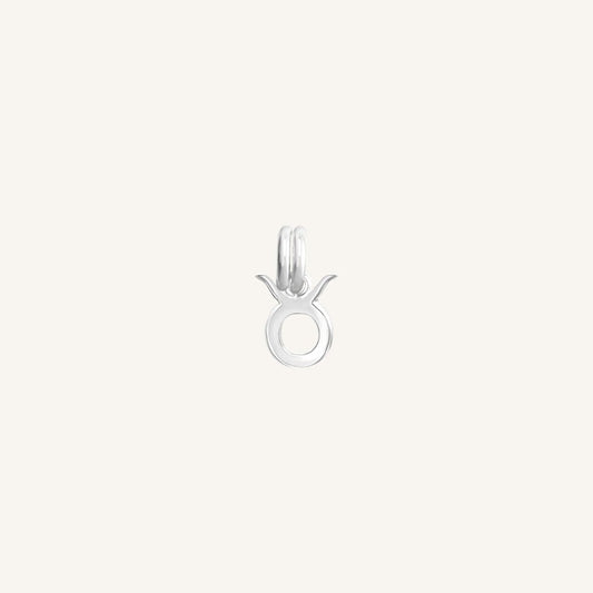 A silver-coloured Petite Zodiac Charm representing the Taurus sign.