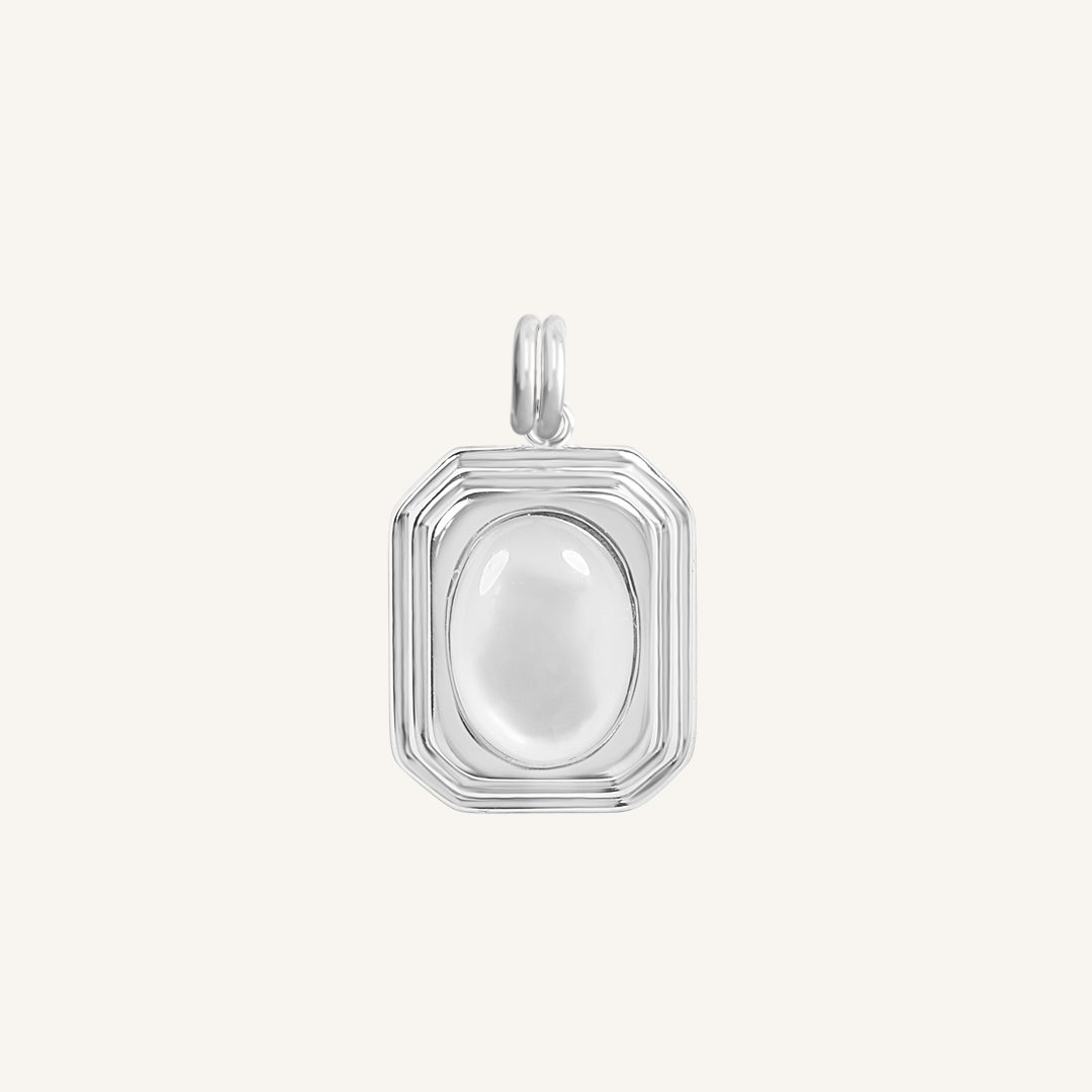 A silver-colored pendant with an oval mother-of-pearl stone in the center, isolated on a white background.
