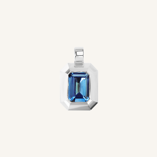 silver charm with Blue emerald cut cubic zirconia bezel set Inspired by the halls of Versailles on white background