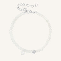 Silver bracelet with beads on a white background