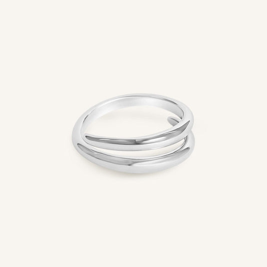 Silver ring with three bands on a white background