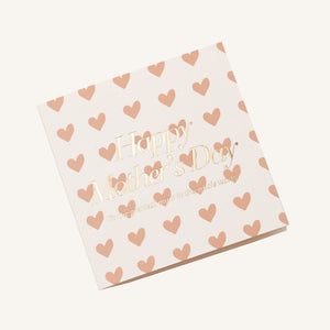 A selection of greeting cards displayed on a neutral background, featuring designs such as 'Happy Mother's Day', hearts, and the words 'mum' along with a general 'Love you mum' message.