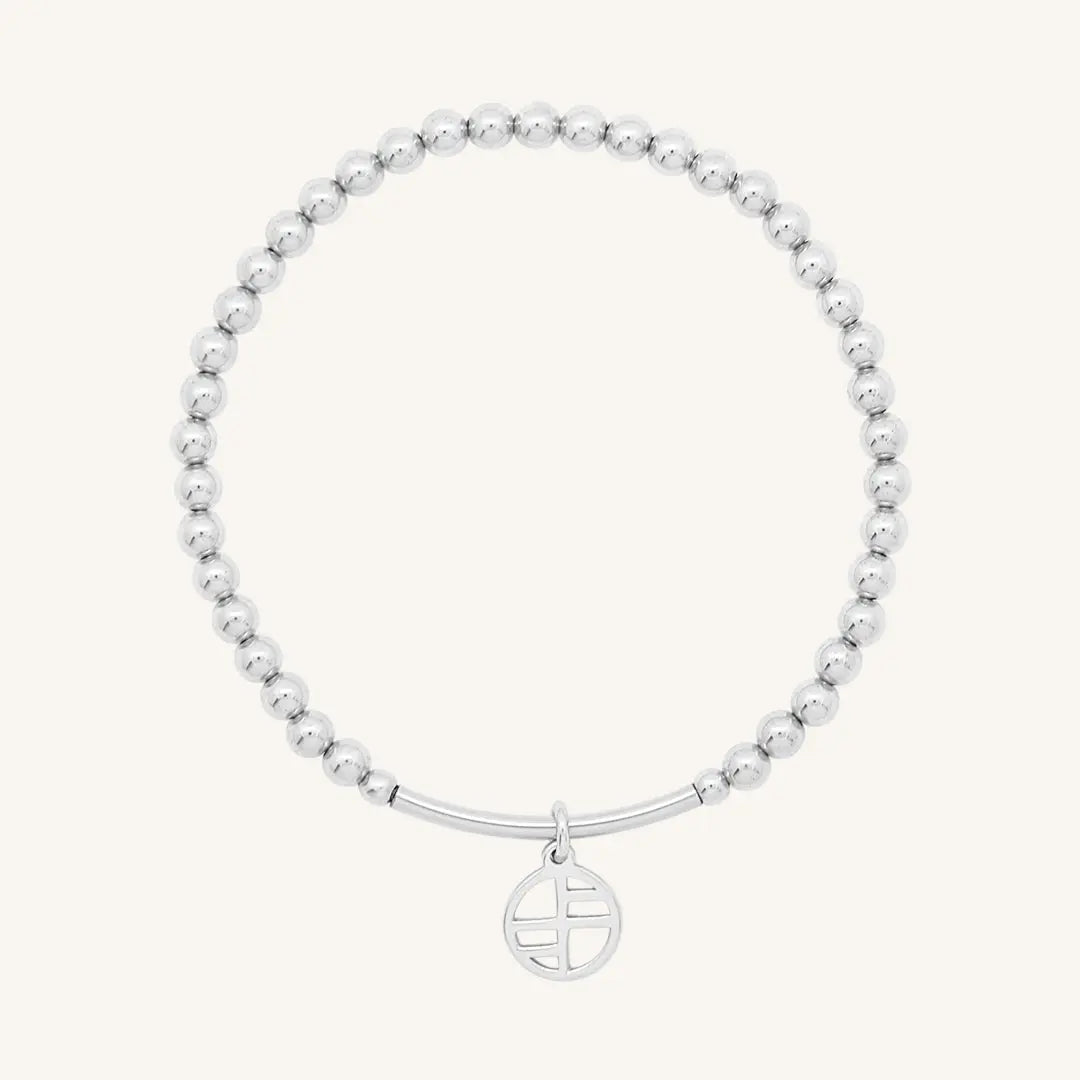 A silver-tone charm bracelet with 4mm beads and a charm pendant hanging in the center.