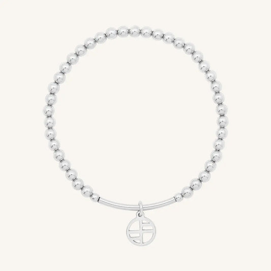 A silver-tone charm bracelet with 4mm beads and a charm pendant hanging in the center.