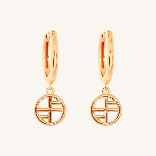 A pair of rose-tone drop earrings with the francesca logo